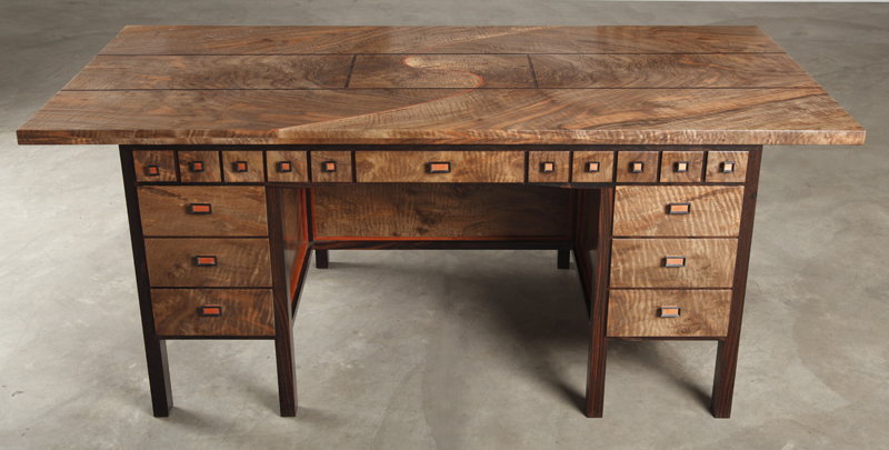 Beautiful wooden desk with many drawers.