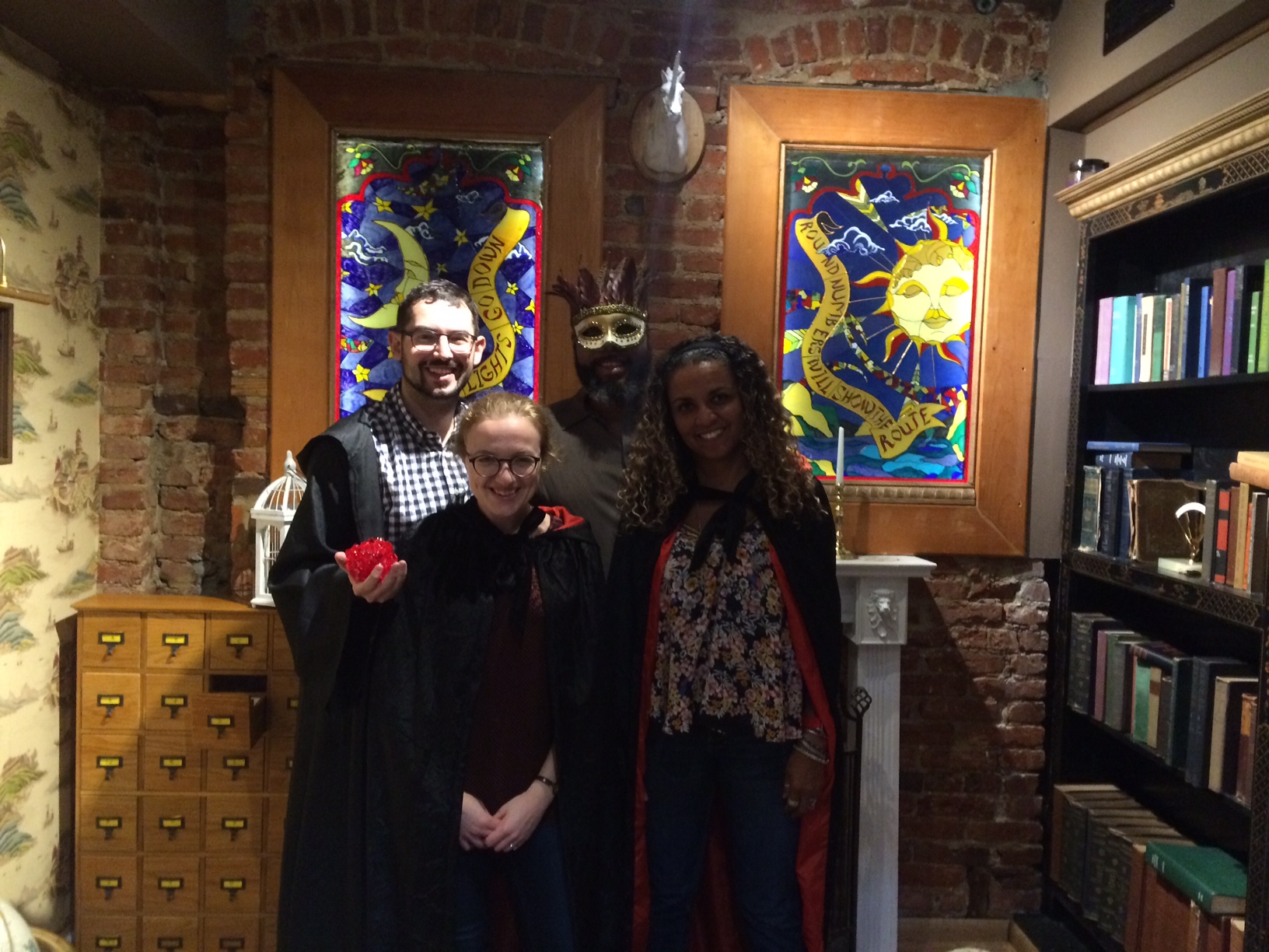 Team victory photo taken in the Alchemist's study.