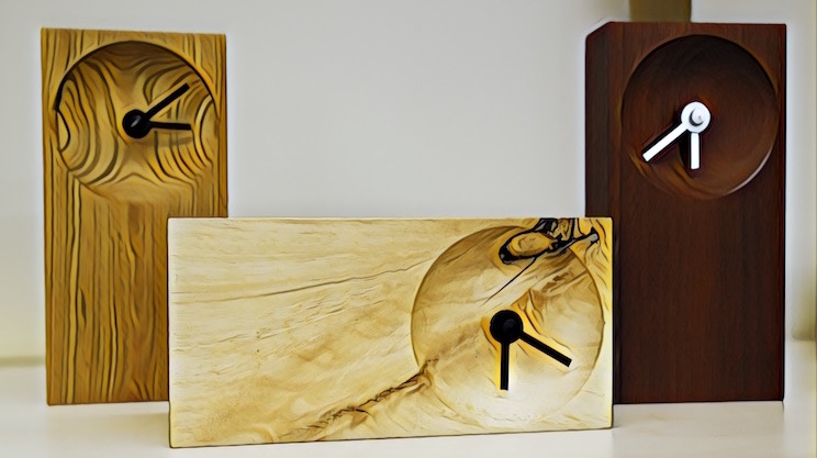 Stylized image of three beautifully handcrafted, minimalistic wood clocks.