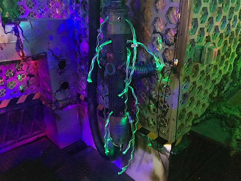 In-game: Part of the ship with glowing green tendrils. Everything looks like a mixture of technology and biology.