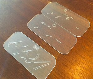 Transparent Digit Puzzle with two pieces stacked. It's possible to guess the numbers with the incomplete information.