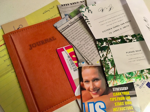 An assortment of papers from Dispatch, On The Run. Newspaper clippings, a journal, wedding invitation, a wedding toast, the cover of a tabloid magazine. 
