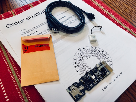 The Prototype board with all of the other components. They are sitting on top of a cipher wheel.