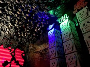 In-game: 4 pillars of skulls, above them, the ceiling is covered in skulls.