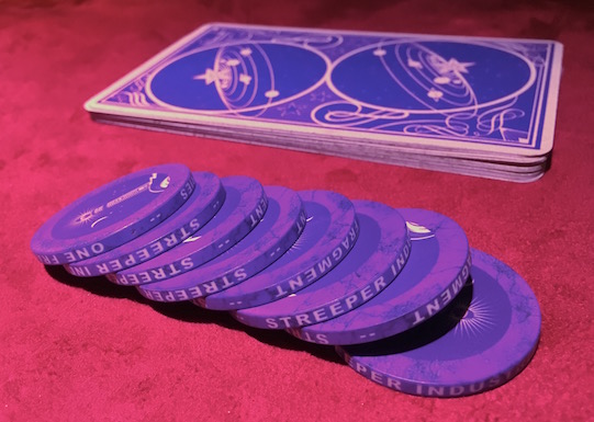 In-game: A deck of cards and a stack of poker chips.