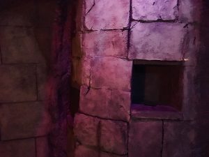 In-game: the stone walls of an Egyptian tomb, there are compartments carved out of the walls.