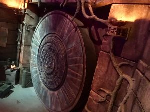 In-game: A massive stone circular temple door.