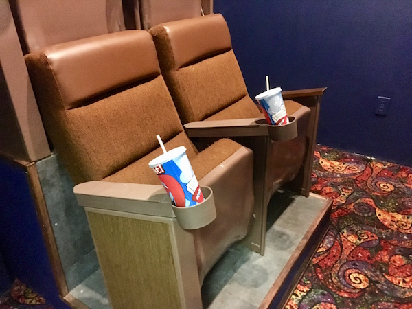 In-game: A set of 4 movie theater seats in a small theater.