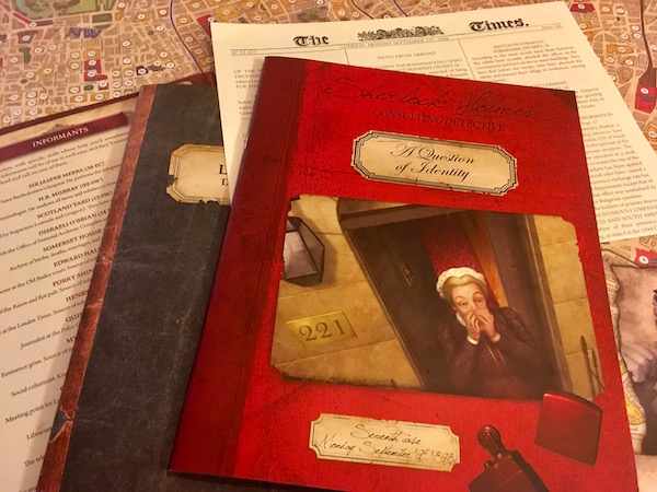 The game's map, a case book, a newspaper, the informants list, and the London Directory laid out on the table. 