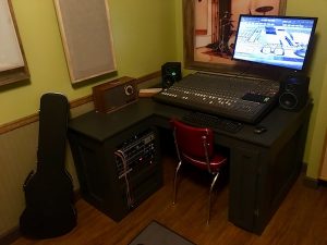 In-game: A music studio's mixing station.