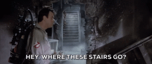 Dan Aykroyd in Ghostbusters looking at creepy stairway asking, "Hey, where these stairs go?"