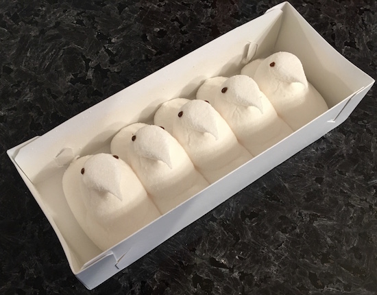 An open carton of 5 white Mystery Flavor Peeps.