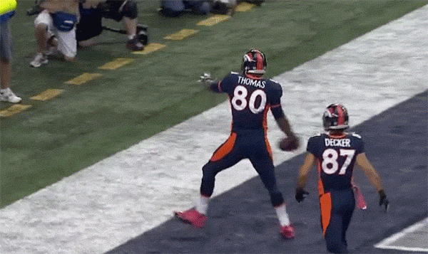 Julius Thomas spiking a football, then it bounces back into his face. 