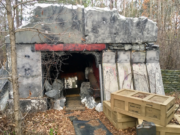 The exterior of the Bunker. It looks incredibly detailed, rundown, and militaristic.