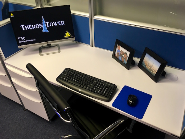 In-game: A cubical with a computer desk.