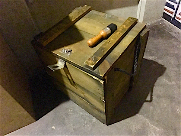 In-game: a large wooden crate and a brush.