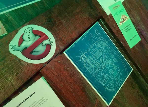 In-game: A close up of the proton pack schematics and the Ghostbusters logo.
