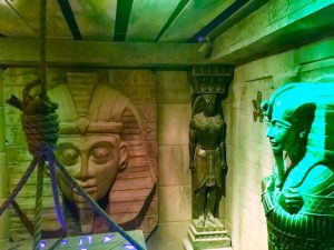 In-game: A massive sphinx head on the wall of an Egyptian tomb.