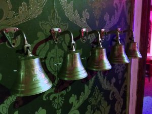 In-game: a series of bells labeled "TITANIC."