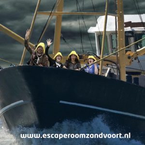 Post game green screen photo the team on the bow of the ship.