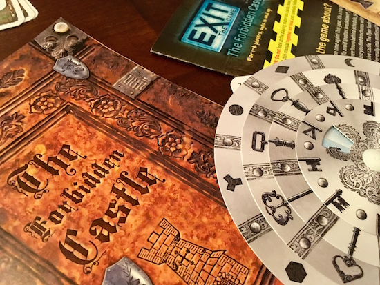 Exit The Game: The Forbidden Castle's booklet and decoder wheel.