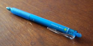 A blue FriXion Ball pen