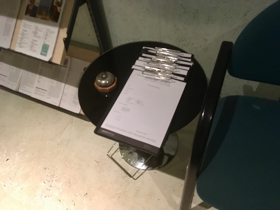 In-game: a stack of intake forms in the lobby.