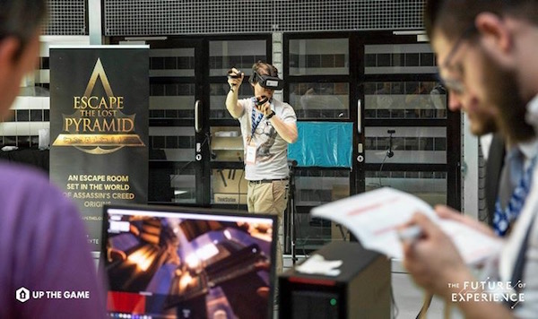 Someone playing the Ubisoft VR Escape The Lost Pyramid escape room set in the wold of Assassin's Creed Origins.