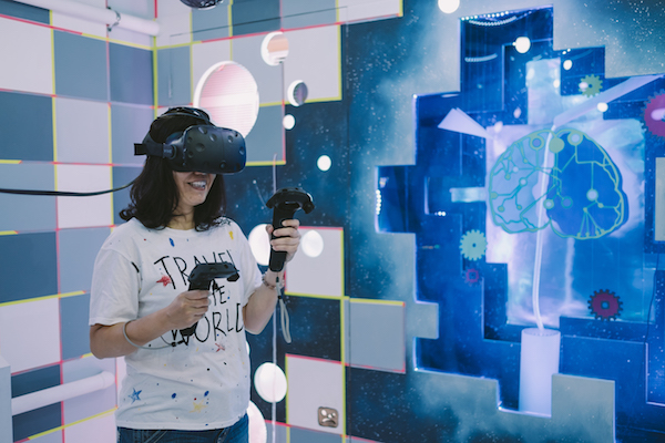 Un-Destined - Someone wearing a VR kit in space-y escape room like setting. 