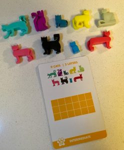 An intermediate puzzle layout for Cat Stax and the corresponding cat pieces.