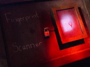 In-game: a fingerprint scanner secured with a padlock.