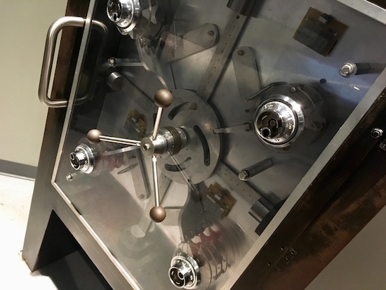 In-game: A large safe with 4 different wheels.