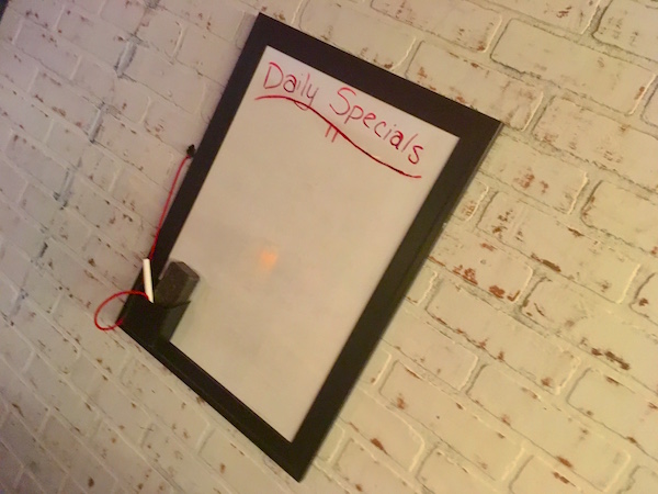 In-game: The "Daily Specials" white board.