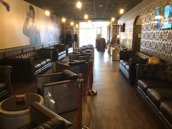 The Escapology steampunk lobby filled with leather couches and ample seating.