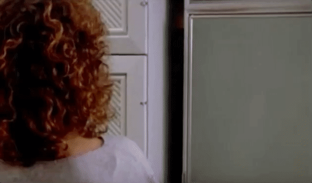 Dana opening her refrigerator, a warm otherworldly light glows from within.