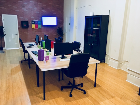 In-game: An open office with 4 desks.