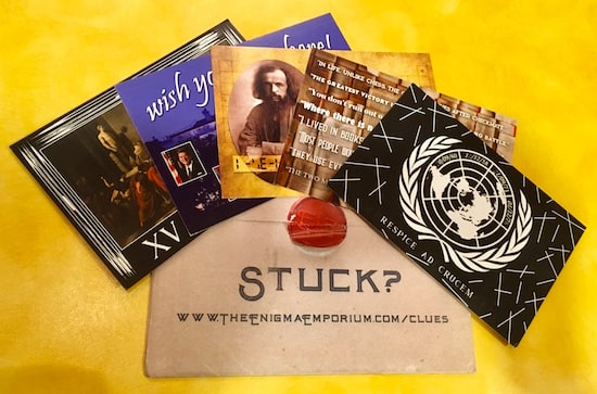 The assortment of Enigma Emporium cards and the envelope.
