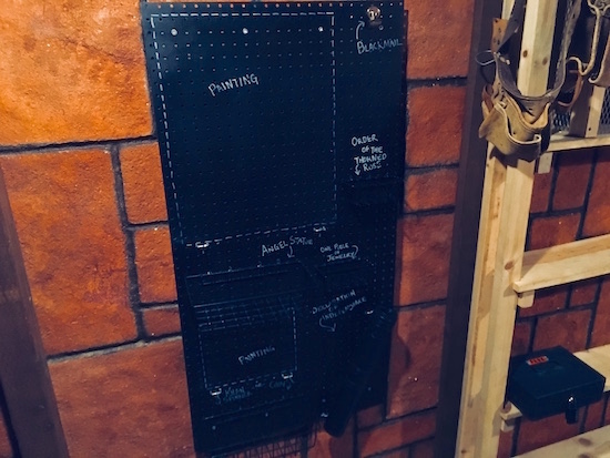 In-game: a pegboard with storage for all of the loot gathered in the game.