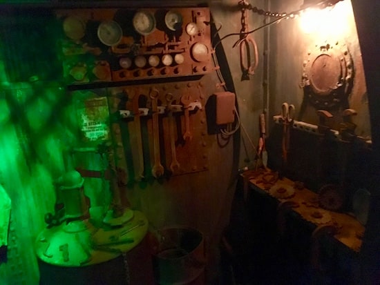 In-game: a workshop and a set of gauges and valves.