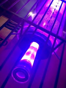 In-game: a massive hamster water dispenser, lit purple.