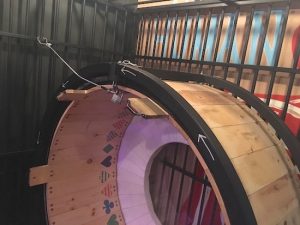 In-game: a large hamster wheel in a cage.