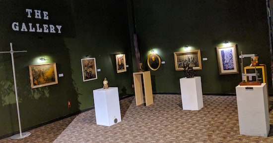 The Museum of Intrigue's art gallery with paintings and sculptures on display.