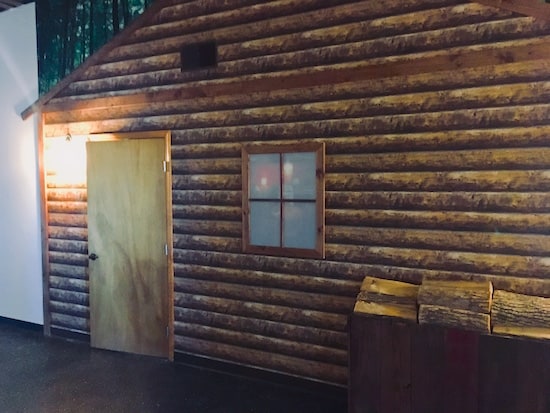 The exterior of Cabin in the Woods. Looks like a log cabin. 