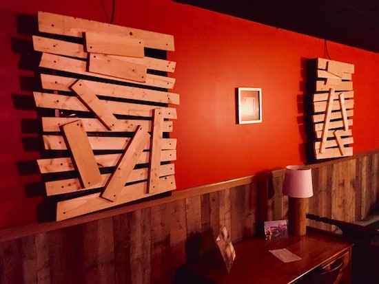 In-game: boarded up windows in a cabin. 