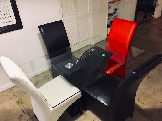 In-game: a dining table in an apartment.