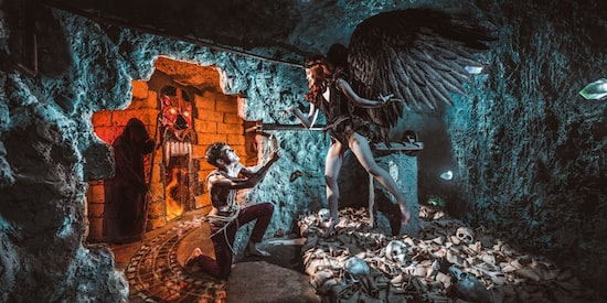 Claustrophobia game promo: a black winged angel in a tomb