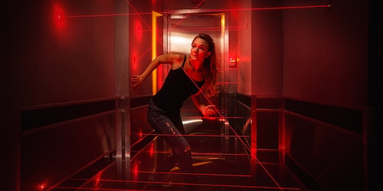 Claustrophobia game promo: a woman in a laser maze