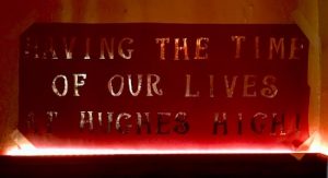 In-game: Prom banner reads, "Having the time of our lives at Hughes High!"