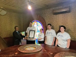 Game 22 post-game photo features the Guinness judge presenting their certificate.