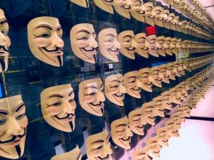 An endless wall of Guy Fawkes masks.